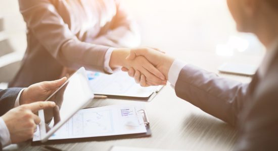 Business people shaking hands, finishing up a meeting